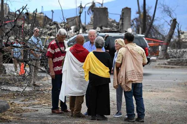 Biden and US First Lady Jill Biden participate in a blessing ceremony with the Lahaina elders at Moku'ula following wildfires in Lahaina, Hawaii on August 21, 2023. The Bidens are expected to meet with first responders, survivors, and local officials following deadly wildfires in Maui.