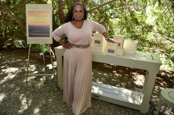 Oprah Winfrey standing next to a table at her Gospel Brunch in Montecito, California celebrating her new book 'Wisdom of Sundays'