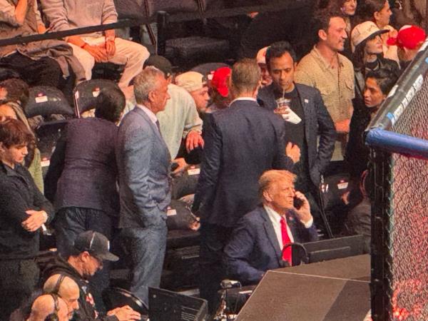 RFK Jr. and Vivek Ramaswamy stood near president-elect Trump as he appeared to take a phone call.